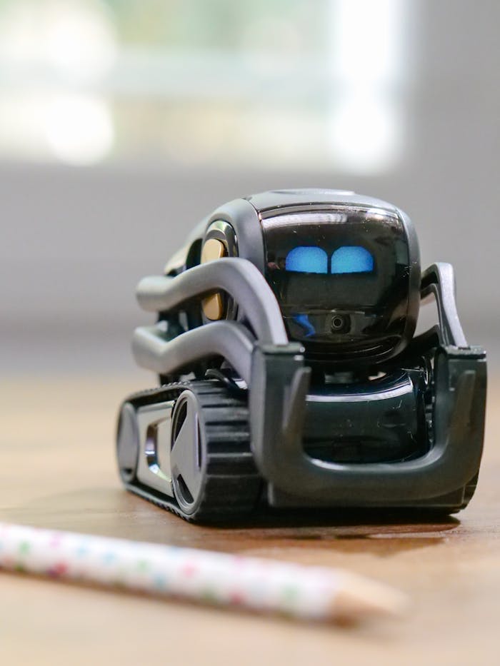 Explore the futuristic design of a miniature AI-powered robotic toy with modern technology elements.